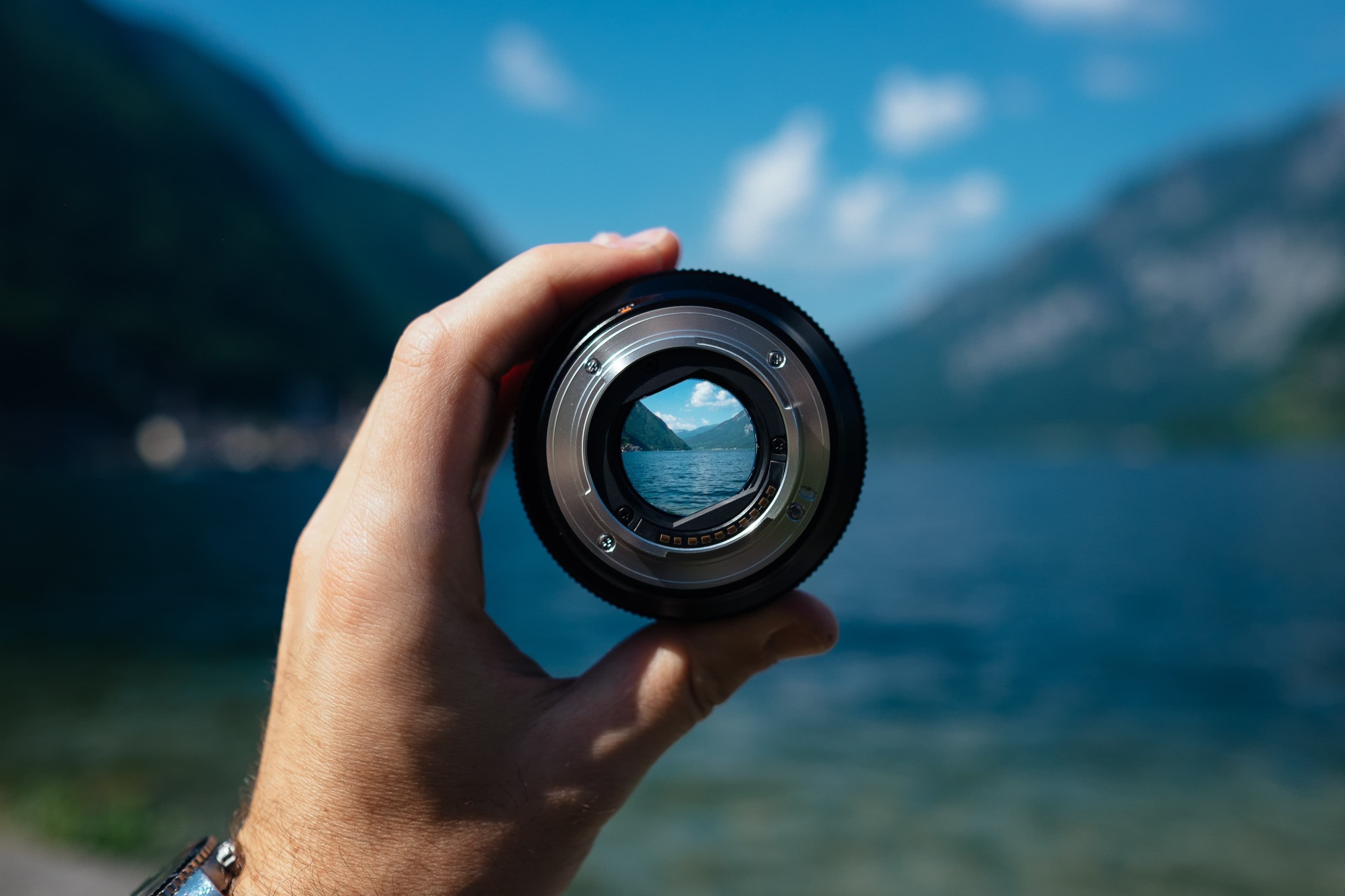 Guy looking through a camera lens to show that life isnt blurry but clear
